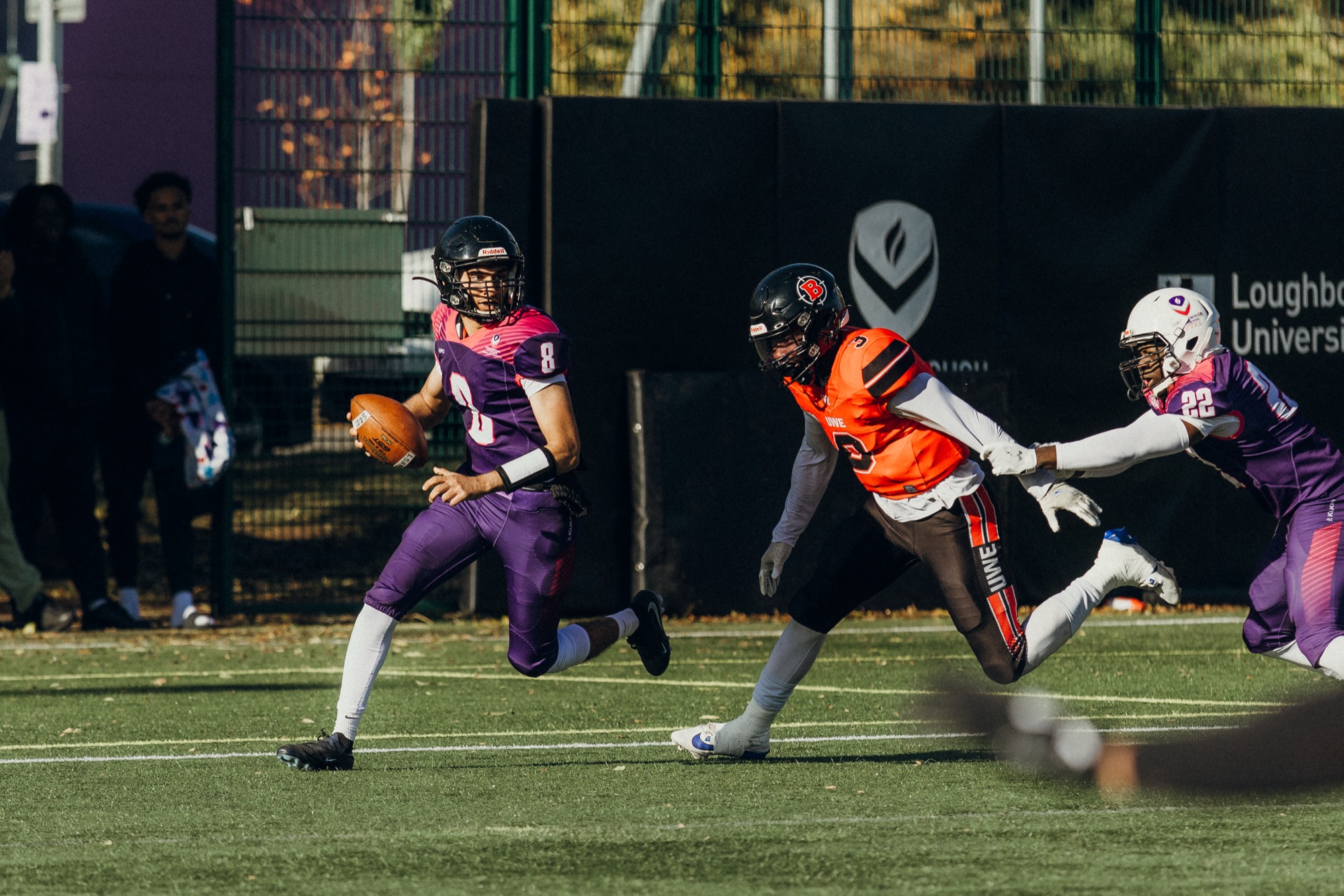 Adam Hydari scrambling with the ball as quarterback at Loughborough University